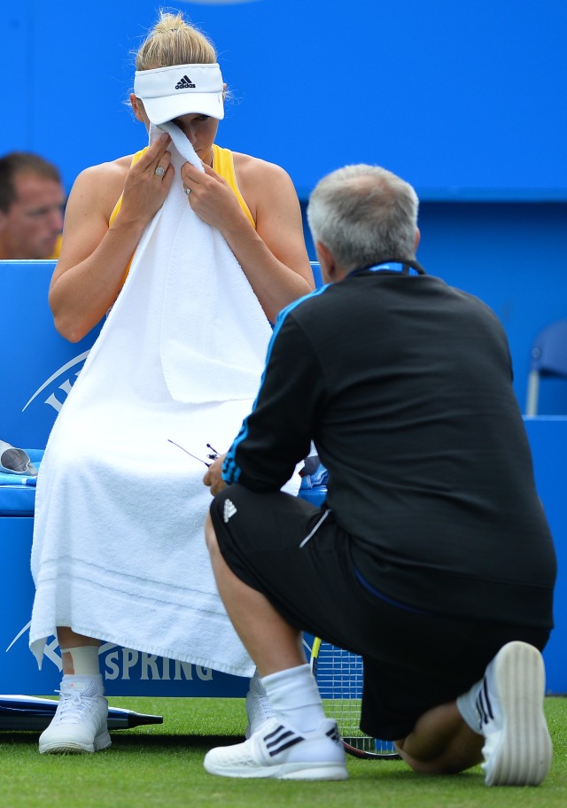 Caroline Wozniacki dan Piotr Wozniacki di WTA Final 2014. (Foto: GLYN KIRK / AFP)