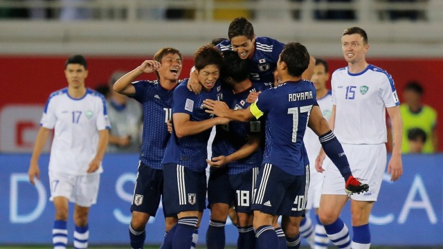 Timnas Jepang merayakan kemenangan di Piala Asia. (Foto: REUTERS/Thaier Al-Sudani)