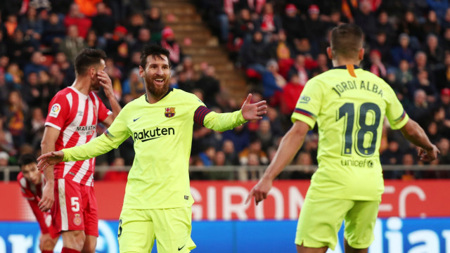 Lionel Messi merayakan golnya ke gawang Girona bersama sobatnya, Jordi Alba. (Foto: REUTERS/Sergio Perez)