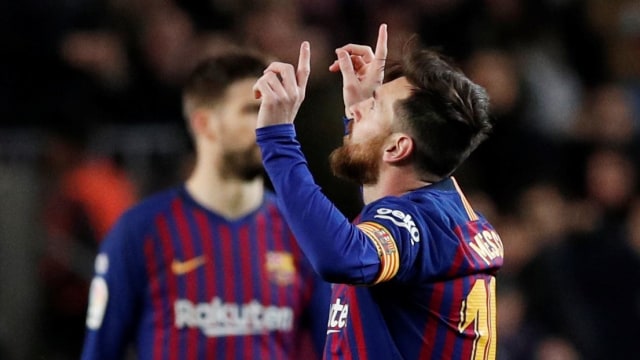 Selebrasi dari Lionel Messi usai membobol gawang Valencia. Foto: REUTERS/Albert Gea