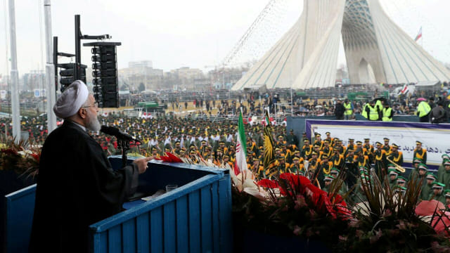 Presiden Iran Hassan Rouhani berpidato saat upacara untuk memperingati 40 tahun Revolusi Islam di Teheran, Iran. Foto: Official President website/Handout via REUTERS
