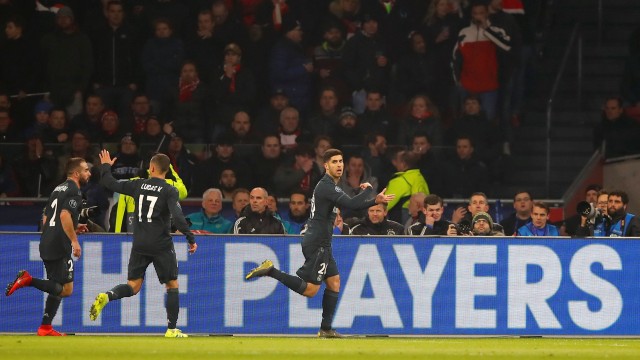 Marco Asensio merayakan gol di laga babak 16 besar Liga Champions 2018/19. Foto: REUTERS/Wolfgang Rattay