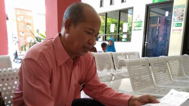 Ipda Suwondo, Kanit PPA Polresta Pasuruan saat membaca hasil tes kehamilan NS. Selasa, (26/2/2019)