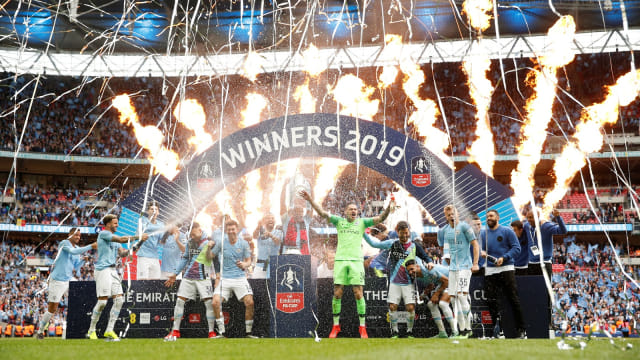 Manchester City merayakan gelar Piala FA. Foto: Reuters/John Sibley
