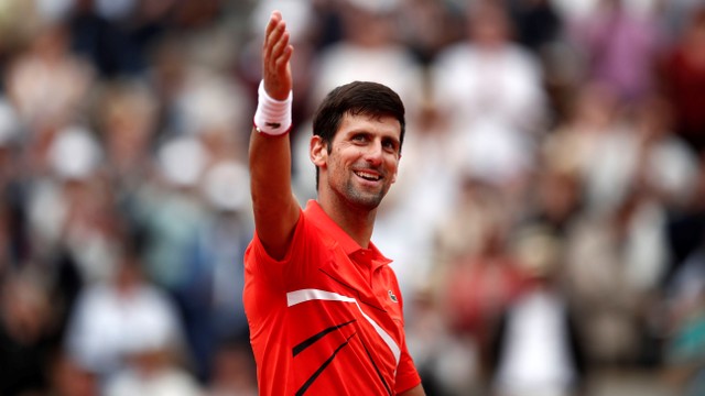 Novak Djokovic merayakan kemenangannya di babak kedua Prancis Terbuka 2019. Foto: REUTERS/Benoit Tessier