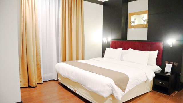 Ruang tidur di dalam kamar bertipe Condotel terbagi atas dua ukuran, yaitu Queen Size dan Single Size Foto: Helinsa Rasputri/kumparan