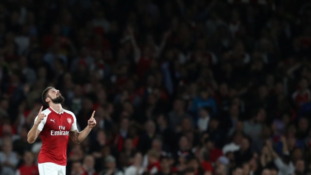 Giroud kala merayakan gol. (Foto: Eddie Keogh/Reuters)