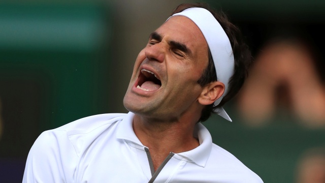 Roger Federer merayakan kemenangan atas Rafael Nadal. Foto: Reuters/Pool