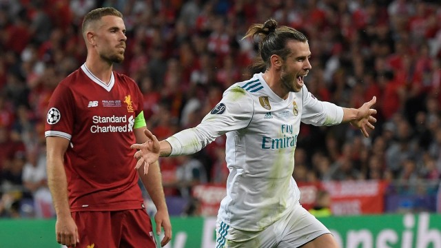 Gareth Bale menjadi pahlawan Real Madrid lewat dua golnya ke gawang Liverpool pada final Liga Champions 2017/18. Foto: AFP/Lluis Gene