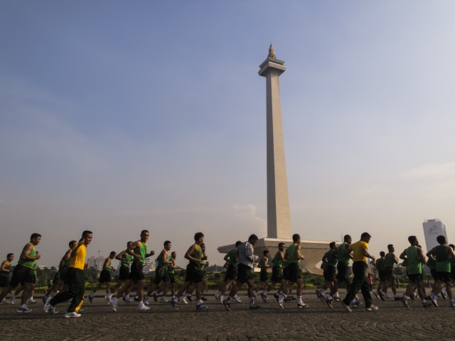 com-Ilustrasi orang-orang berlari di sekitar Monumen Nasional, Jakarta Foto: Pete Niesen/Shutterstock