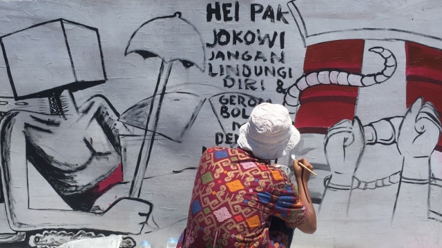 Aktivis yang tergabung dari koalisi masyarakat sipil Aceh menggelar aksi mendukung KPK dan menolak revisi UU KPK di Taman Bustanul Salatin, Banda Aceh, Aceh. Foto: Zuhri Noviandi/kumparan 