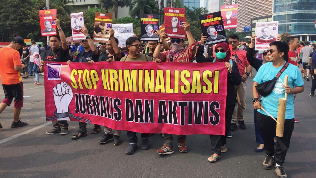 Aksi Aliansi Jurnalis Independen (AJI) di area CFD Bunderan HI, Jakarta Pusat. Foto: Raga Imam/kumparan