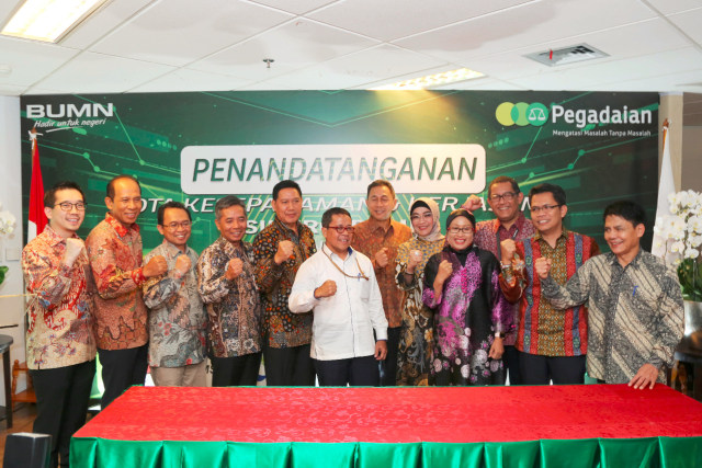 Bank BRI dan Pegadaian menandatangani nota kesepahaman tentang sinergi bisnis di Gedung Kementerian BUMN, Jakarta, Senin (30/9) Foto: Dok. BRI