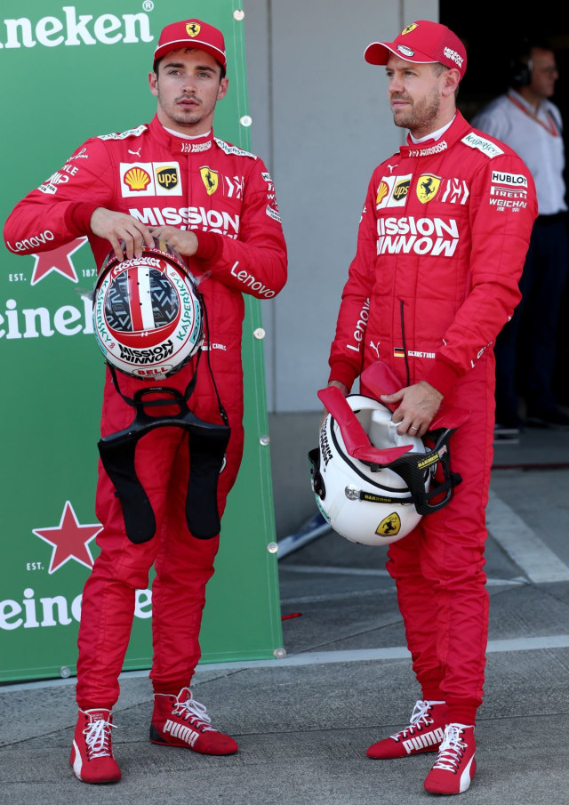 Charles Leclerc (kiri) dan Sebastian Vettel  (kanan). Foto: Behrouz MEHRI / AFP