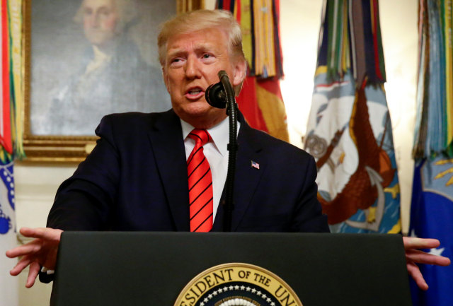 Presiden Amerika Serikat, Donald Trump menyampaikan pernyataannya terkait kematian Abu Bakr al-Baghdadi di White House, Minggu (27/10/2019). Foto: REUTERS/Jim Bourg