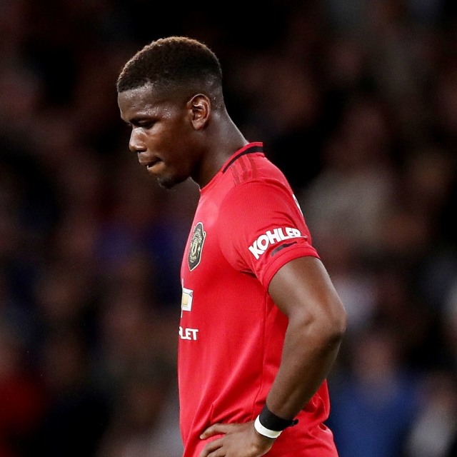 Paul Pogba masih belum bisa memperkuat Manchester United. Foto: Reuters/Carl Recine