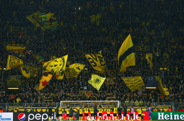 Ilustrasi suporter Borussia Dortmund. Foto: REUTERS/Thilo Schmuelgen