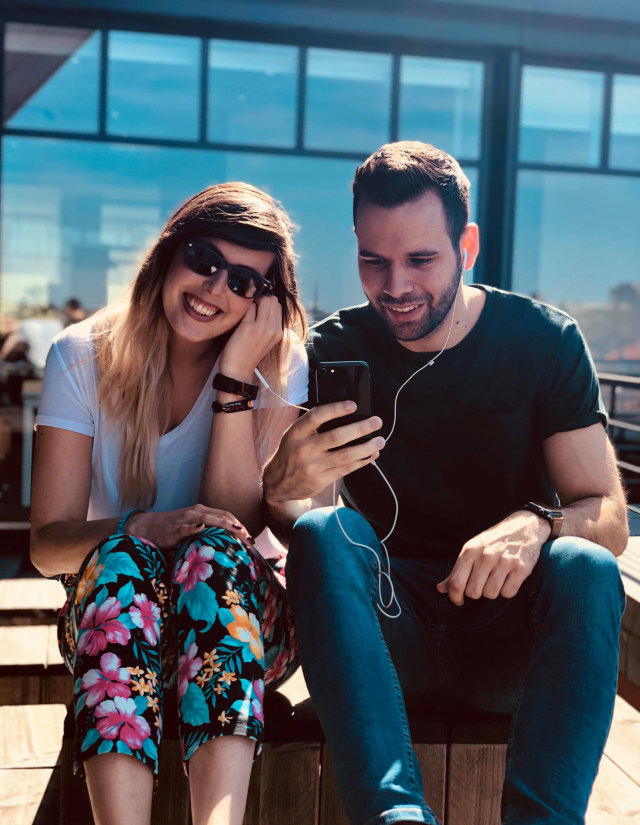 man-and-woman-using-an-earphones-1044488.jpg