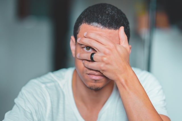 photo-of-man-covering-his-face-1674730.jpg