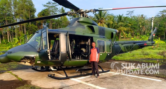 Helikopter milik TNI AD yang mendarat di Kampung Sukawayana, Desa/ Kecamatan Cikakak, Kabupaten Sukabumi. | Sumber Foto:Nandi