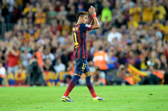 Neymar merayakan kemenangan Barcelona atas Real Madrid pada 2013. Foto: AFP/Lluis Gene