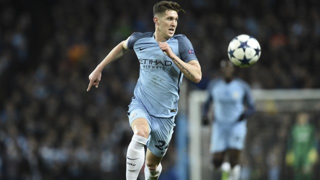 Aksi bek Manchester City, John Stones. (Foto: Oli SCARFF / AFP)