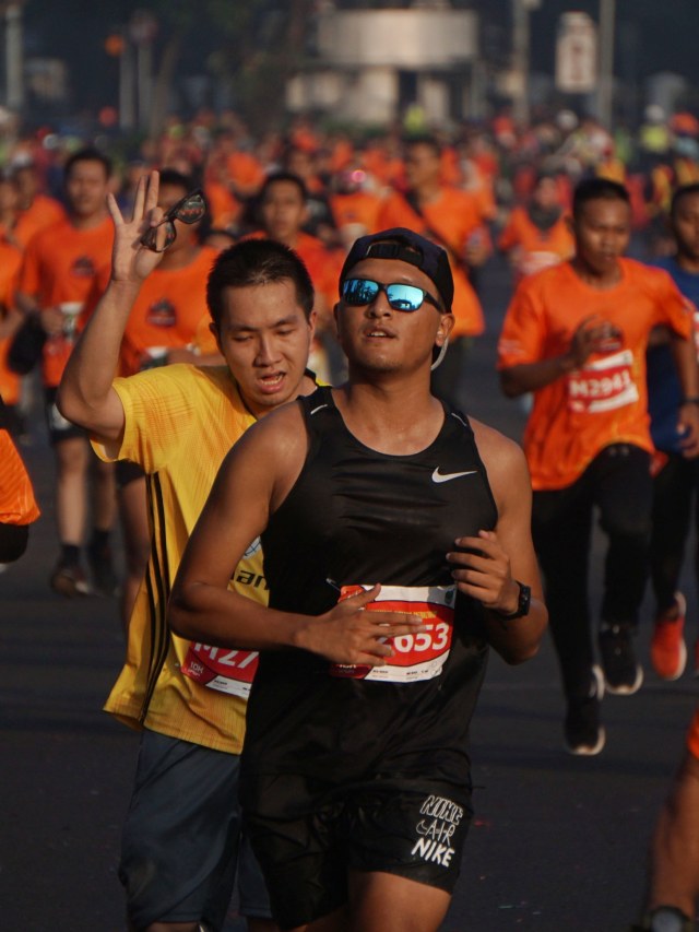 Peserta mengikuti lomba lari Loe Gue Run (LGR) 2020 di Kompleks Monas Jakarta Pusat, Minggu (26/1).  Foto: Jamal Ramadhan/kumparan 