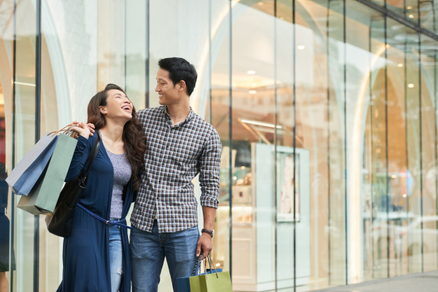 happy-shoppers-laughing-carefree-shopping-mall_1098-18933.jpg