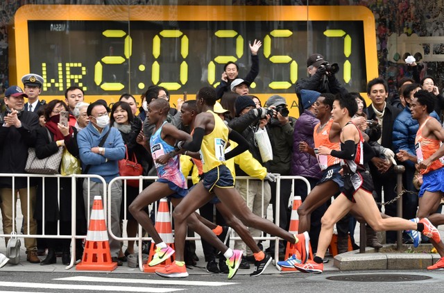 Ilustrasi lari marathon. Foto: AFP/Kazuhiro NOGI