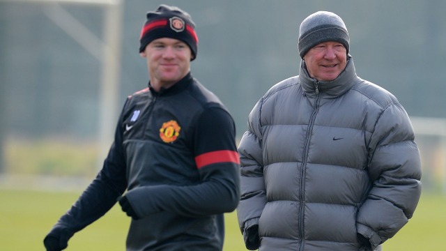 Wayne Rooney dan Sir Alex Ferguson kala masih membela Manchester United. Foto: ANDREW YATES / AFP