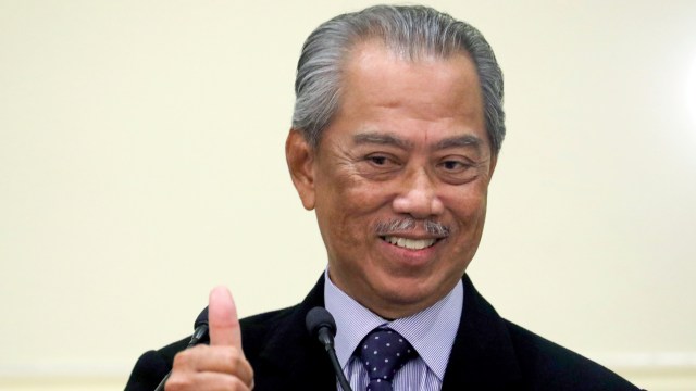 Perdana Menteri Malaysia Muhyiddin Yassin saat umumkan susunan kabinet baru di Putrajaya, Malaysia. Foto: REUTERS / Lim Huey Teng