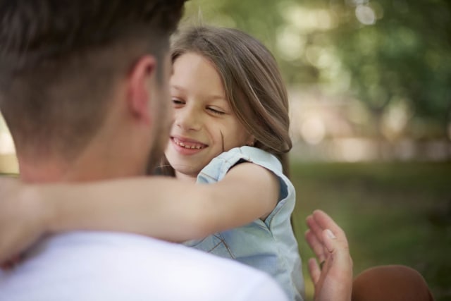 girl-with-arms-around-dad-smiling-with-trees-in-background_27aef0d2f4171c8b0fe5d926ed95ebdb.jpg
