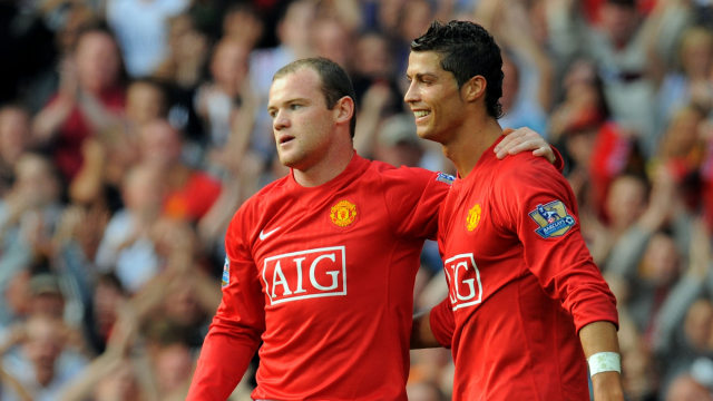 Wayne Rooney dan Cristiano Ronaldo saat berseragam Manchester United. Foto: ANDREW YATES / AFP