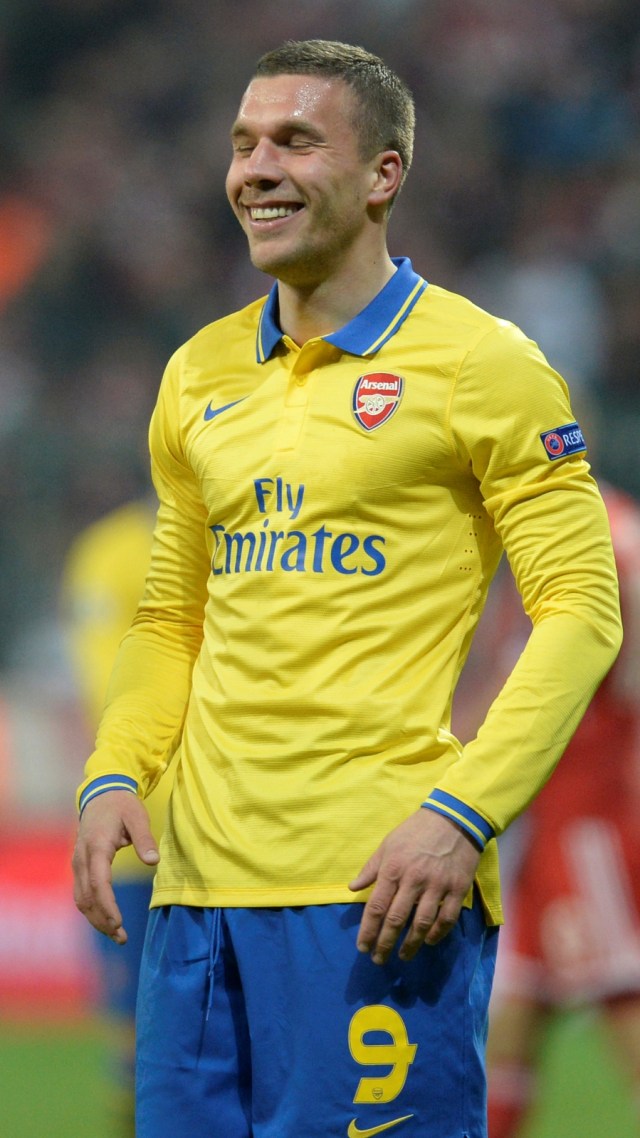 Lukas Podolski saat berseragam Arsenal. Foto: CHRISTOF STACHE / AFP