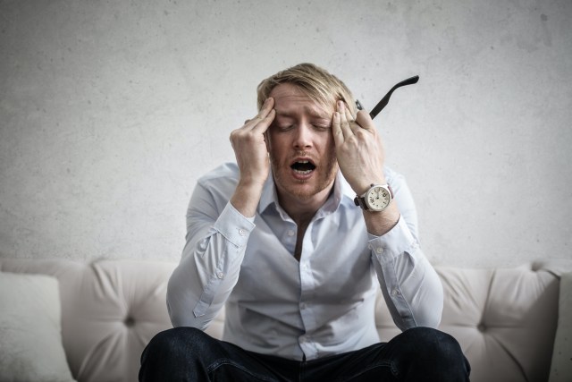 photo-of-man-touching-his-head-3752834.jpg