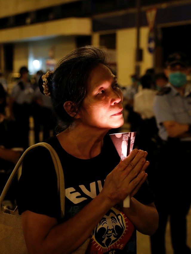 Peringatan 31 tahun penumpasan protes pro-demokrasi di Lapangan Tiananme, Beijing. Foto: REUTERS/Tyrone Siu