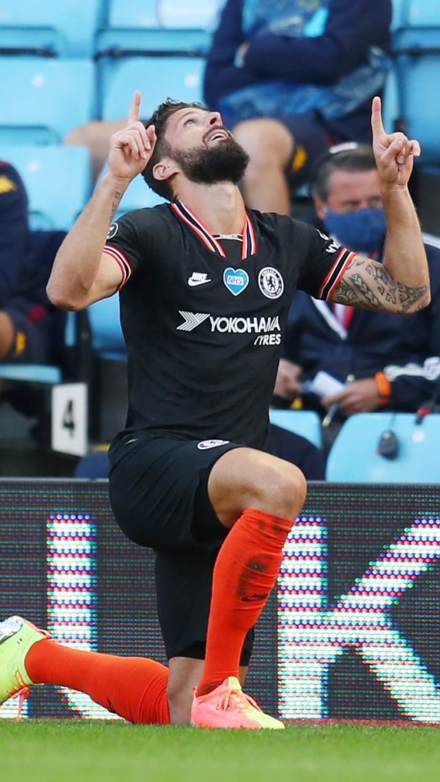 Pemain Chelsea, Olivier Giroud merayakan gol kedua mereka ke gawang Aston Villa saat pertandingan Liga Premier. Foto: Catherine Ivill/Pool via REUTERS