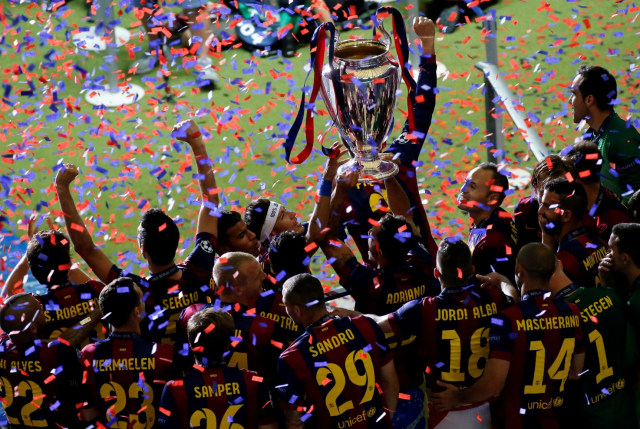 Momen Barcelona juara Liga Champions 2014/15. Foto: REUTERS/Fabrizio Bensch/File Photo