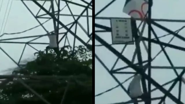 Pria naik menara sutet. (Foto: @nenk_update/Instagram)