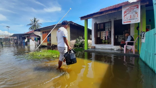 Banjir masih menggenangi sejumlah wilayah di Gorontalo. Jumat, (10/7). Foto: Dok banthayoid (Wawan Akuba)