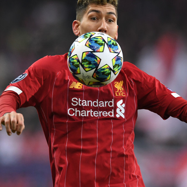 Roberto Firmino, sosok vital di skema Liverpool. Foto: Bulent Kilic / AFP