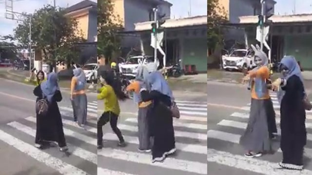Tangkapan video tiga perempuan di Mamuju asyik berjoget di lampu merah. Foto: Kolase Tangkapan Video