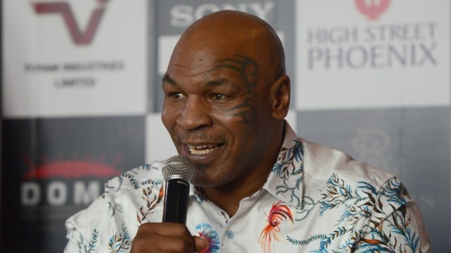 Mike Tyson , legenda tinju . Foto: PUNIT PARANJPE / AFP