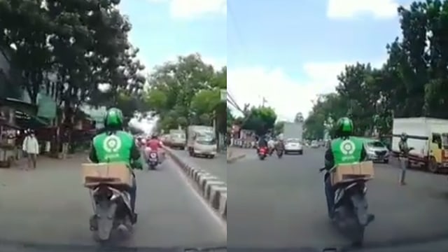 Pengendara ojol main HP dan menghalangi jalan. (Foto: @dashcam_owners_indonesia/Instagram)
