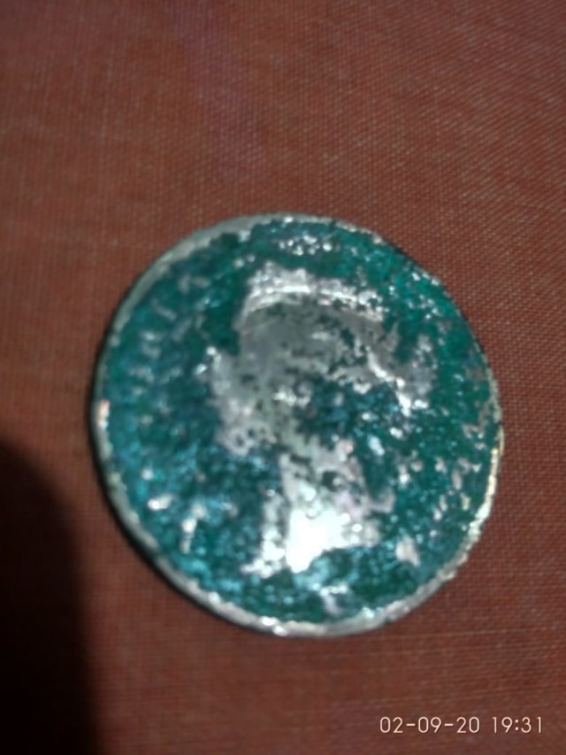 Uang logam yang ditemukan para penggali kubur di Pidie Jaya, Aceh. Foto: Dok. Istimewa