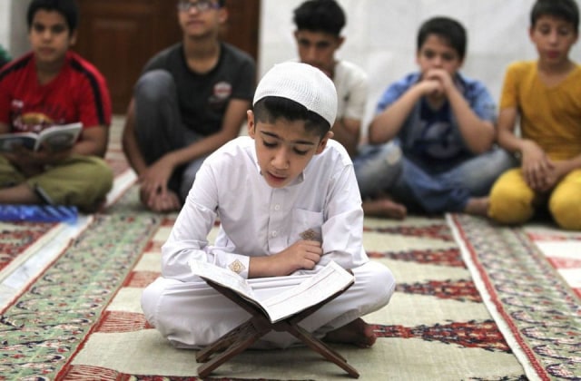 Membaca Al Quran Foto: dok Online Quran Courses for Kids