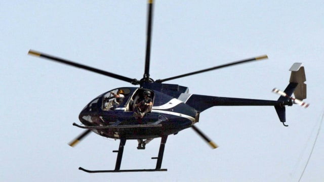 Helikopter perusahaan keamanan swasta AS Blackwater terbang di atas Baghdad. Foto: Ali Yussef/AFP