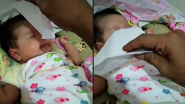 Momen bayi rewel langsung tidur usai dihipnotis. (Foto: @wahdahagehamoetz/TikTok)