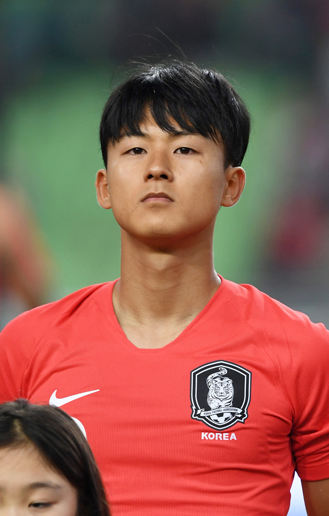 Pemain Timnas Korea Selatan, Lee Seung-woo. Foto: Martin BUREAU / AFP