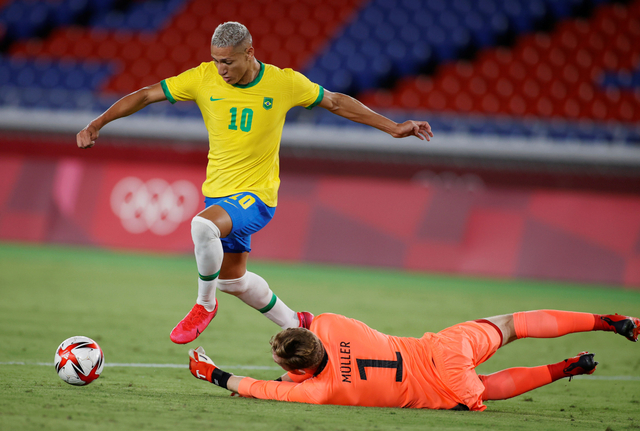 Brazil's Richarlison duels with Germany's Florian Mueller during the Tokyo 2020 Olympics match at Yokohama International Stadium, Japan.  Photo: Phil Noble/Reuters